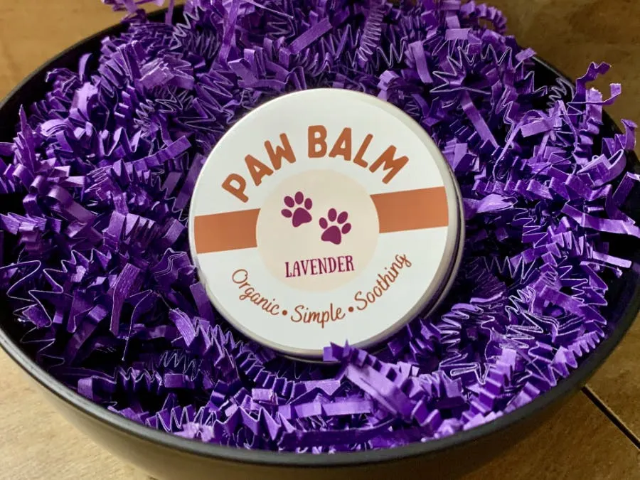 Person using a pen to cross a task off a productivity paper card.